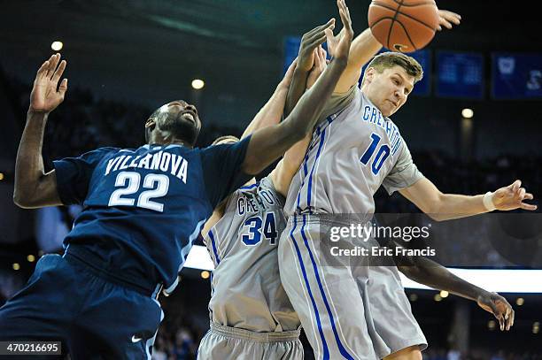 Grant Gibbs of the Creighton Bluejays and JayVaughn Pinkston of the Villanova Wildcats battle for a rebound during their game at CenturyLink Center...