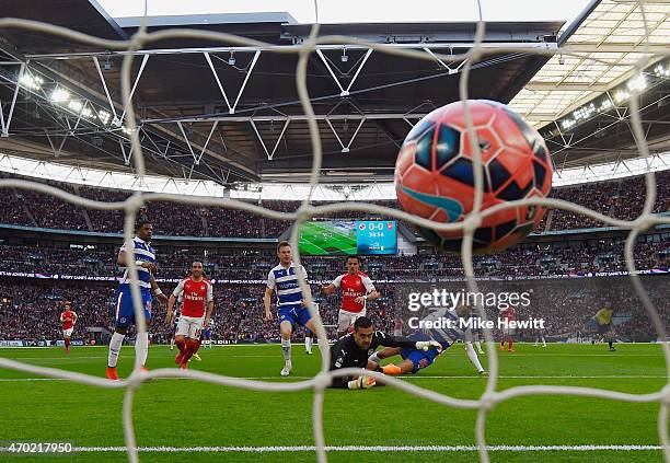 Alexis Sanchez of Arsenal scores the opening goal past goalkeeper Adam Federici of Reading during the FA Cup Semi Final between Arsenal and Reading...