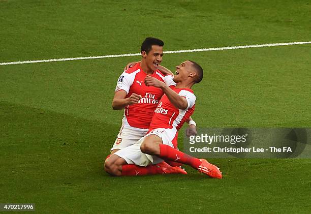 Alexis Sanchez of Arsenal celebrates with team-mate Kieran Gibbs of Arsenal after scoring his team's first goal during the FA Cup Semi-Final match...