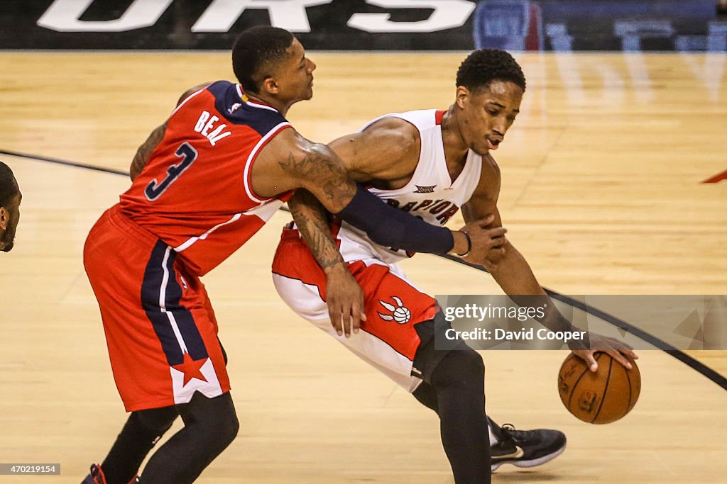 Bradley Beal (3) of the Washington Wizards takes a foul on DeMar DeRozan (10) of the Toronto Raptors as the clock winds down in the 2nd quarter of