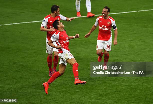 Alexis Sanchez of Arsenal celebrates with team-mates after scoring his second goal during extra time in the FA Cup Semi-Final match between Arsenal...
