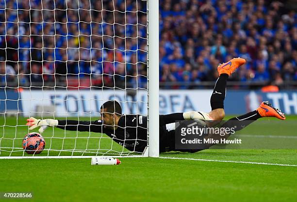 Adam Federici of Reading stretches for the ball as he fails to stop a shot by Alexis Sanchez of Arsenal for their second goal during the FA Cup Semi...