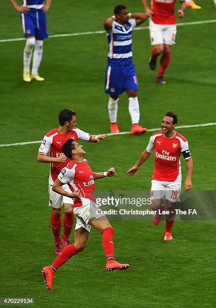 Alexis Sanchez of Arsenal celebrates with team-mates after scoring his second goal during extra time in the FA Cup Semi-Final match between Arsenal...