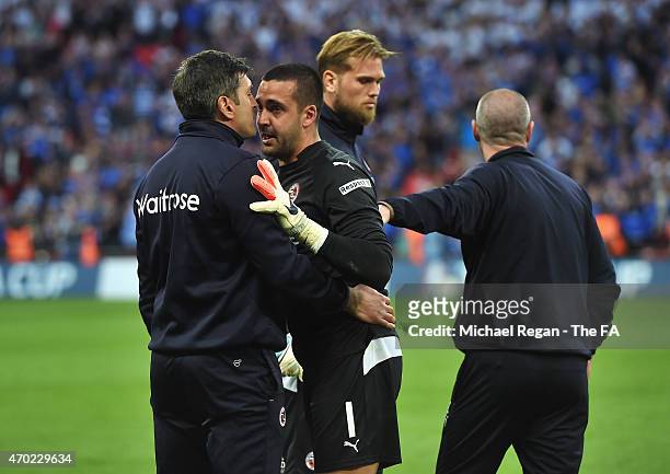 Adam Federici of Reading is consoled after the team lost the FA Cup Semi-Final match between Arsenal and Reading at Wembley Stadium on April 18, 2015...