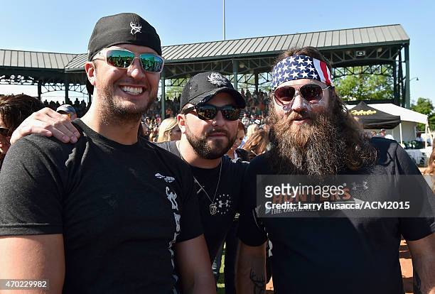 Recording artist Luke Bryan, recording artist Tyler Farr, and TV personality Willie Robertson attend the ACM & Cabela's Great Outdoor Archery Event...