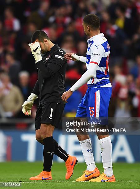 Adam Federici of Reading is consoled by team-mate Michael Hector of Reading after the team lost the FA Cup Semi-Final match between Arsenal and...