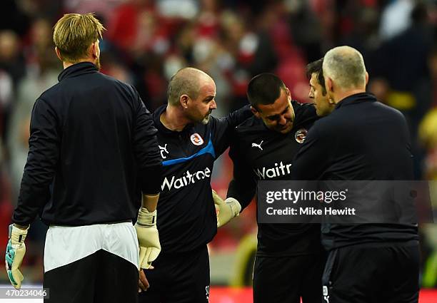 Adam Federici of Reading is consoled by Steve Clarke manager of Reading after the FA Cup Semi Final between Arsenal and Reading at Wembley Stadium on...