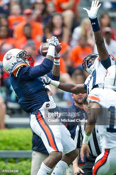 Haquille Williams of Auburn Tigers catches the ball for a touchdown over Kamryn Melton of Auburn TigersAuburn's A-Day game on April 18, 2015 at...