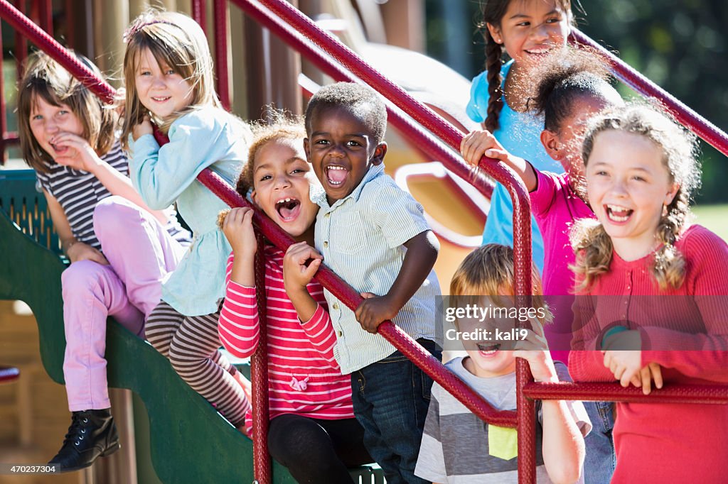 Big group of multi-ethnic children on a sunny playground