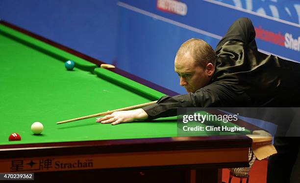 Graeme Dott of Scotland in action against Ricky Walden of England during day one of the Betfred World Snooker Championship at Crucible Theatre on...