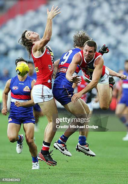 Dylan Roberton and Jarryn Geary of the Saints contest for the ball against Jake Stringer of the Bulldogs during the round two AFL NAB Challenge Cup...