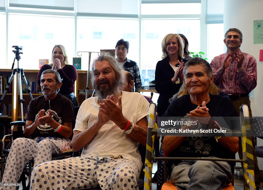 Two members of The Doobie Brothers band, Tom Johnston and Patrick Simmons, play a few of their songs acoustically for patients and visitors at Denver Health, inside the hospital's Child Life ZONE.