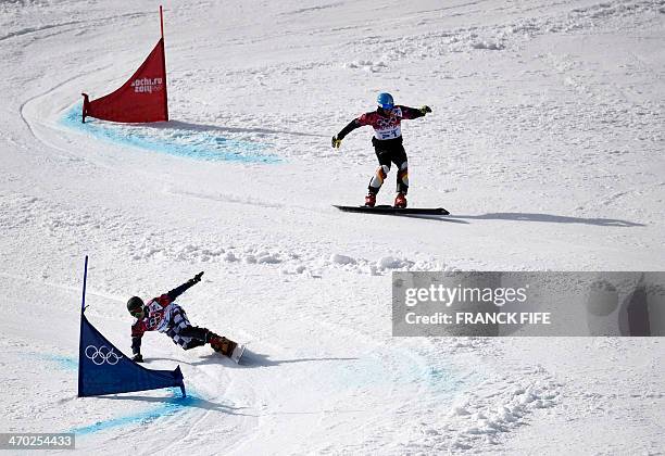 Germany's Patrick Bussler and Russia's Vic Wild compete in the Men's Snowboard Parallel Giant Slalom Semifinals at the Rosa Khutor Extreme Park...