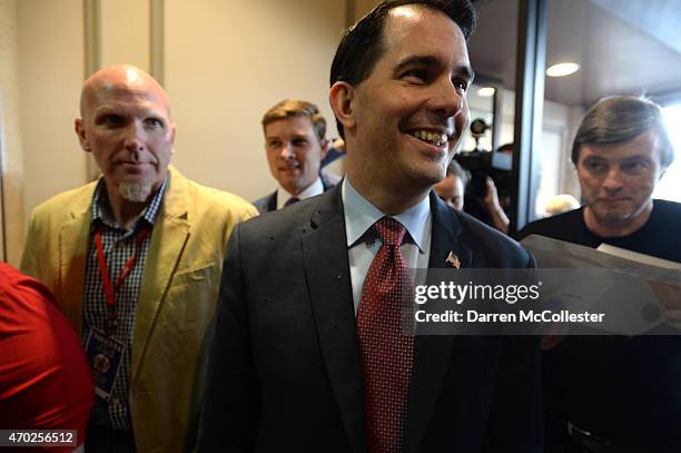 Sen. Scott Walker enters the Crowne Plaza for the First in the Nation Republican Leadership Summit April 18, 2015 in Nashua, New Hampshire. The...