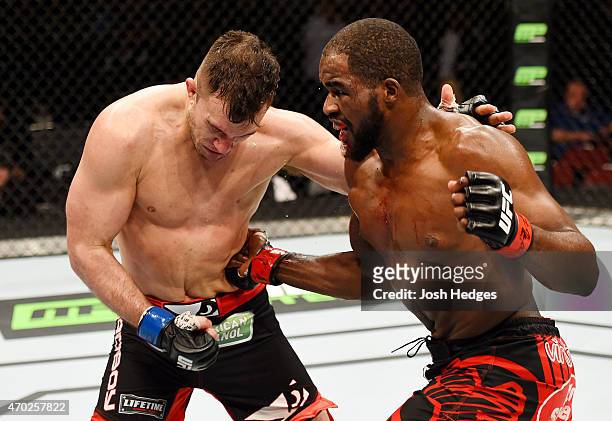 Corey Anderson punches Gian Villante in their light heavyweight bout during the UFC Fight Night event at Prudential Center on April 18, 2015 in...