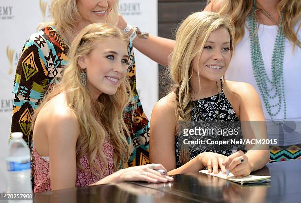 Singer-songwriters Maddie Marlow and Tae Dye of Maddie & Tae attend a meet and greet during the ACM Party For A Cause Festival at Globe Life Park in...