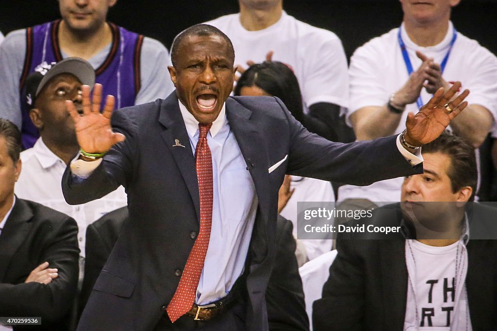 Dwane Casey of the Toronto Raptors works the sidelines