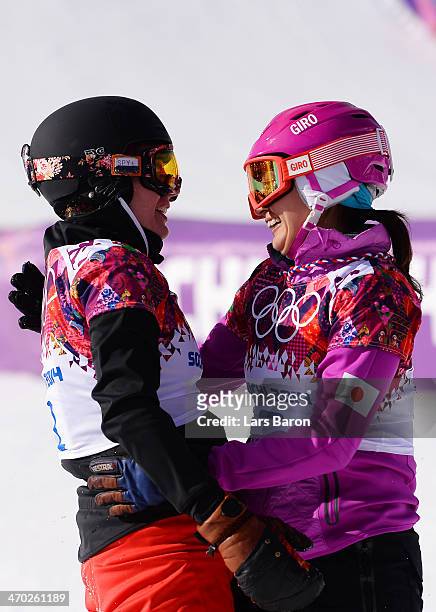 Patrizia Kummer of Switzerland and Tomoka Takeuchi of Japan celebrate winning the gold and silver medals in the Snowboard Ladies' Parallel Giant...