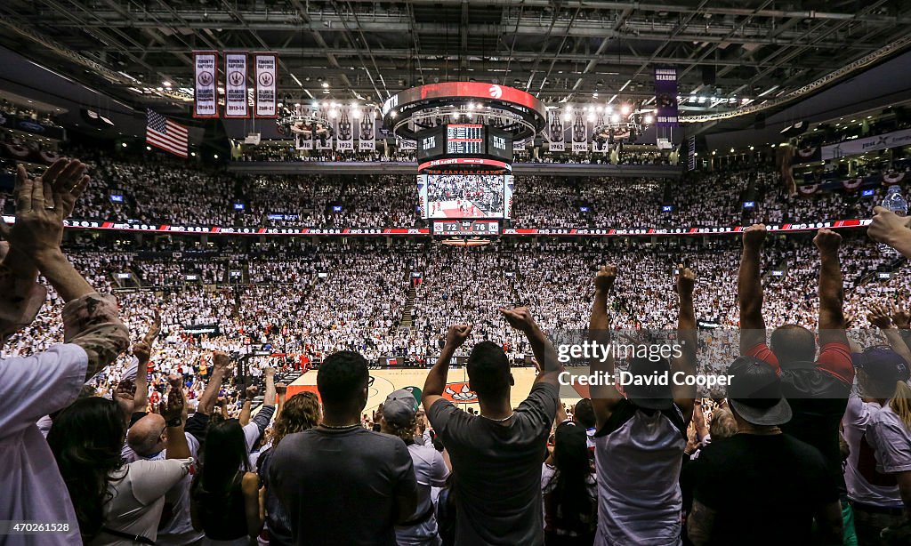 Toronto Raptors fans cheer for their team during a break in the action in the first half of