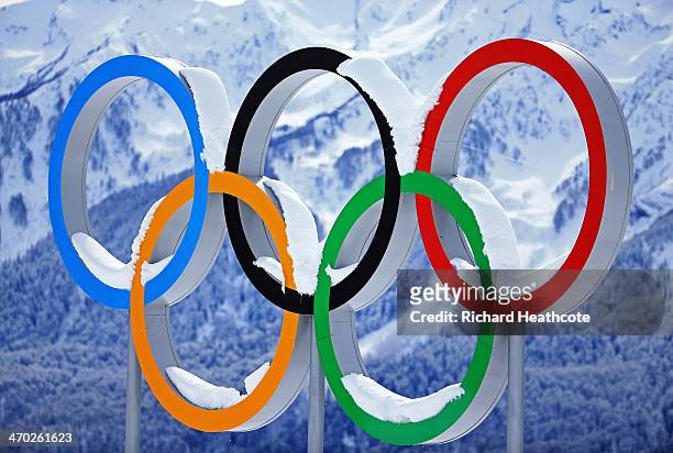 Snow collects on the Olympic Rings during day 12 of the 2014 Sochi Winter Olympics at Laura Cross-country Ski & Biathlon Center on February 19, 2014...