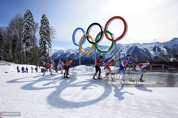 Emil Joensson of Sweden, Iivo Niskanen of Finland, Maciej Kreczmer of Poland and Simeon Hamilton of the United States lead a group past the Olympic...