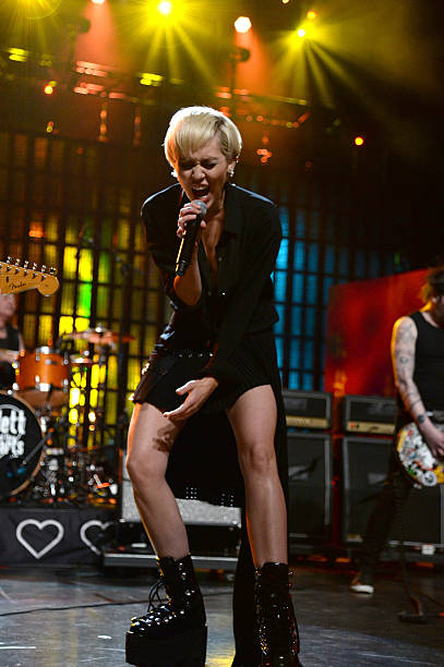 Miley Cyrus, Joan Jett and Tommy James perform onstage during the 30th Annual Rock And Roll Hall Of Fame Induction Ceremony at Public Hall on April...