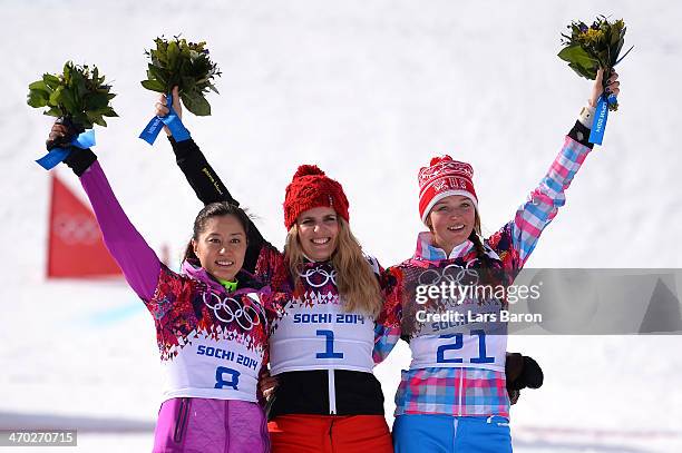 Silver medalist Tomoka Takeuchi of Japan, gold medalist Patrizia Kummer of Switzerland and bronze medalist Alena Zavarzina of Russia celebrate on the...