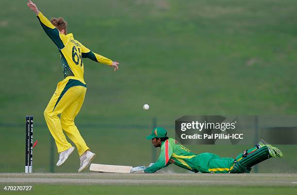 Shadman Islam of Bangladesh gets run out by a direct throw by Jaron Morgan of Australia during the ICC - U19 CWC match between Australia - U19 and...