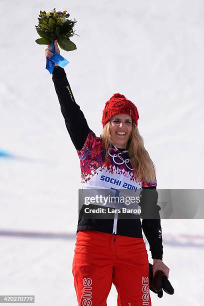 Gold medalist Patrizia Kummer of Switzerland celebrates during the flower ceremony for the Snowboard Ladies' Parallel Giant Slalom Finals on day...