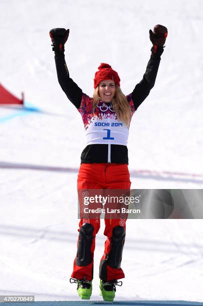 Gold medalist Patrizia Kummer of Switzerland celebrates during the flower ceremony for the Snowboard Ladies' Parallel Giant Slalom Finals on day...