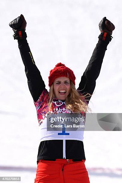 Gold medalist Patrizia Kummer of Switzerland celebrates during the flower ceremony for the Snowboard Ladies' Parallel Giant Slalom Finals on day...