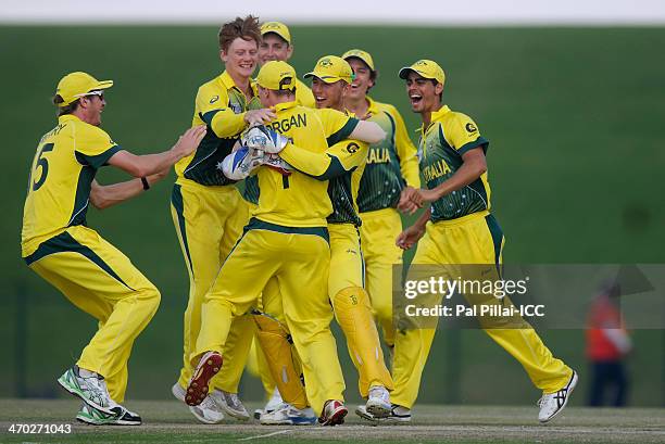 Team mates congratulate Jaron Morgan of Australia as he gets Shadman Islam of Bangladesh run out during the ICC U19 Cricket World Cup 2014 match...