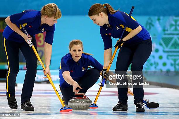 Maria Prytz, Christina Bertrup and Maria Wennerstroem of Sweden compete during the women's curling semifinals at Ice Cube Curling Center on February...