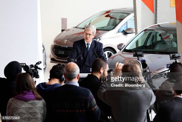 Philippe Varin, outgoing chief executive officer of PSA Peugeot Citroen, speaks to journalists following a news conference to announce the company's...
