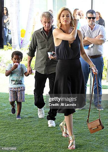 Jackson Theron, Sean Penn and Charlize Theron attends the generationOn West Coast Block Party on April 18, 2015 in Beverly Hills, California.