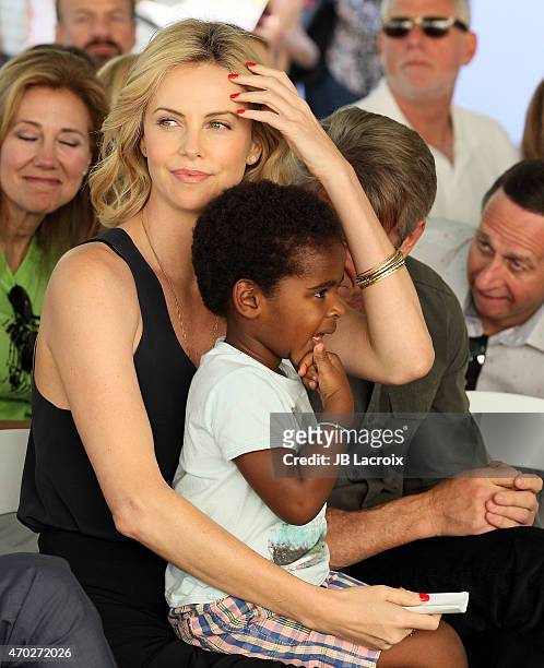 Charlize Theron and Jackson Theron attend the generationOn West Coast Block Party on April 18, 2015 in Beverly Hills, California.