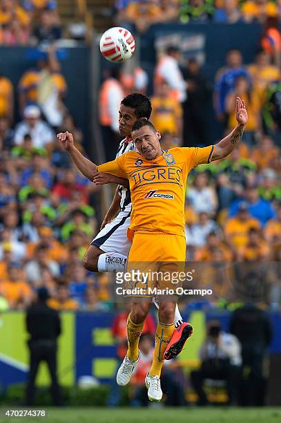 Jesus Duenas of Tigres and Severo Meza of Monterrey jump to head the ball during a match between Tigres UANL and Monterrey as part of 14th round...