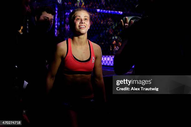 Paige VanZant celebrates defeating Felice Herrig in their women's strawweight bout during the UFC Fight Night event at Prudential Center on April 18,...