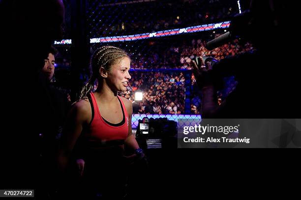 Paige VanZant celebrates defeating Felice Herrig in their women's strawweight bout during the UFC Fight Night event at Prudential Center on April 18,...