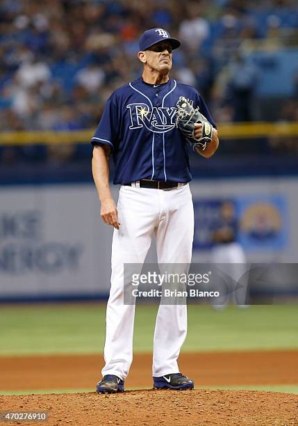 Pitcher Grant Balfour of the Tampa Bay Rays reacts on the mound after hitting Brian McCann of the New York Yankees with a pitch to load the bases...