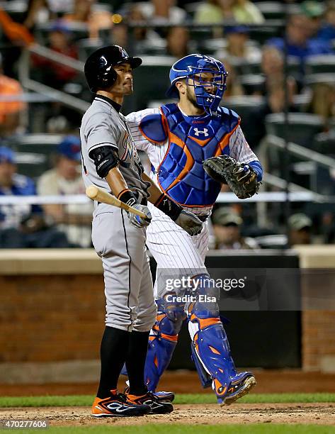 Ichiro Suzuki of the Miami Marlins reacts after he struck out as Travis d'Arnaud of the New York Mets defends on April 18, 2015 at Citi Field in the...