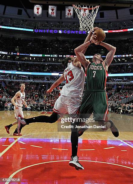 Joakim Noah of the Chicago Bulls knocks the ball away from Ersan Ilyasova of the Milwaukee Bucks during the first round of the 2015 NBA Playoffs at...