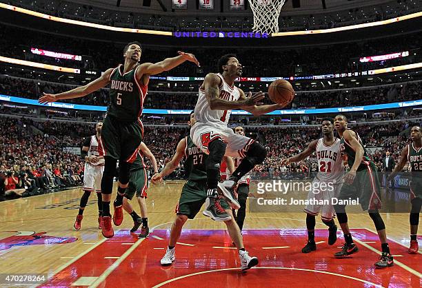 Derrick Rose of the Chicago Bulls drives to the basket past Michael Carter-Williams of the Milwaukee Bucks during the first round of the 2015 NBA...