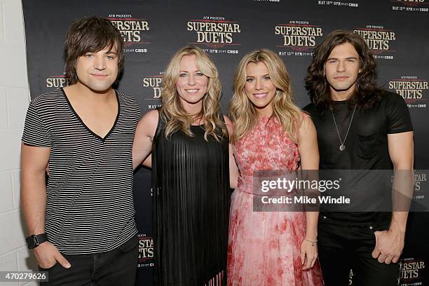 Musicians Neil Perry of The Band Perry, Deana Carter, Kimberly Perry and Reid Perry of The Band Perry pose in the press room during ACM Presents:...