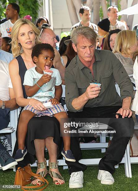 Actress Charlize Theron with her son, Jackson Theron, and actor Sean Penn attend the generationOn west coast block party at Fox Studio Lot on April...