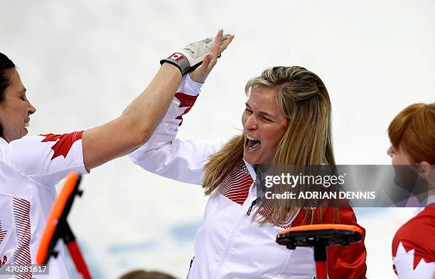 Canada's Skip Jennifer Jones celebrates after throwing the last stone to win the game during the women's semi-final match between Great Britain and...