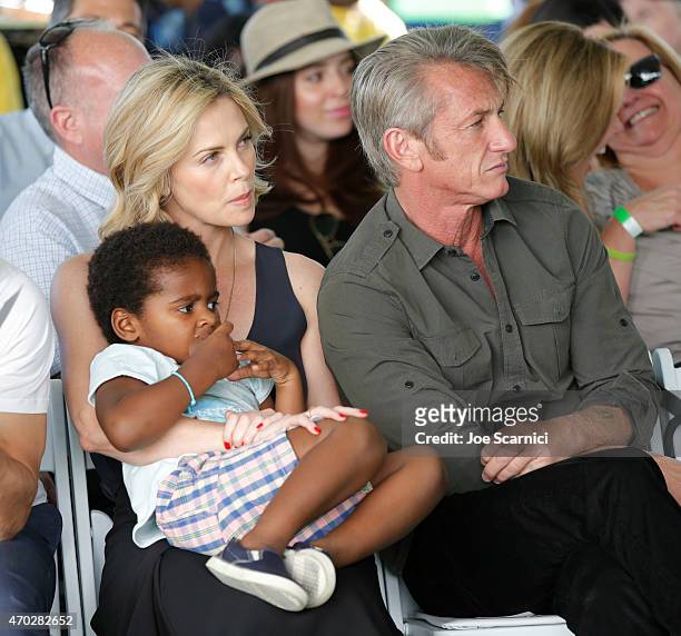 Actress Charlize Theron, Jackson Theron and actor Sean Penn attend the Points of Light generationOn Block Party on April 18, 2015 in Los Angeles,...