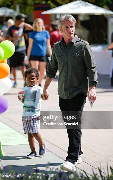 Jackson Theron and actor Sean Penn attend the Points of Light generationOn Block Party on April 18, 2015 in Los Angeles, California.