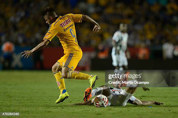 Rafael Sobis of Tigres fights for the ball with Jesus Zavala of Monterrey during a match between Tigres UANL and Monterrey as part of 14th round...