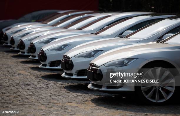 To go with AFP story China-auto-show-environment-Tesla,FOCUS by Bill Savadove This picture taken on March 17, 2015 shows Tesla Model S vehicles...